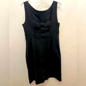Classic little black dress by Kate Spade with open back bow